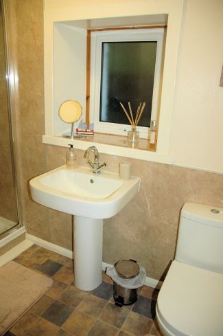 The bathroom in Bruaich Cottage is on the ground floor just off the hall.