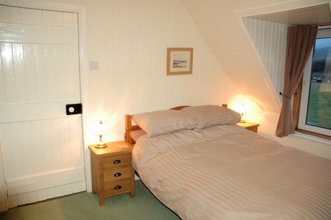 The bedrooms have pine-lined walls and ceilings and are cosy and welcoming. There are superb views from the bedroom windows.