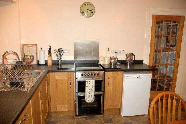 The kitchen in Bruaich Cottage has recently been re-fitted to a high standard with modern kitchen units and appliances.