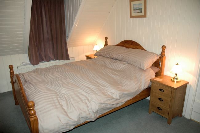 The bedrooms in Bruaich Cottage have pine-lined walls and ceilings and are cosy and welcoming. There are superb views from the bedroom windows.
